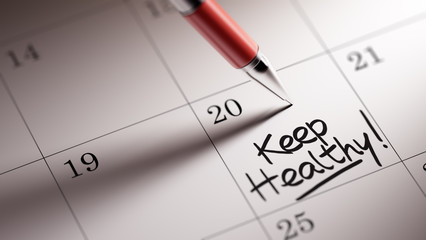 Closeup of a personal agenda setting an important date written w