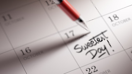 Closeup of a personal agenda setting an important date written w