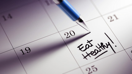 Closeup of a personal agenda setting an important date written w