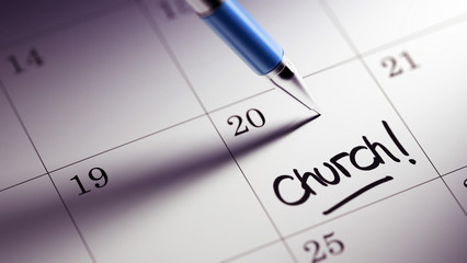 Closeup of a personal agenda setting an important date written w