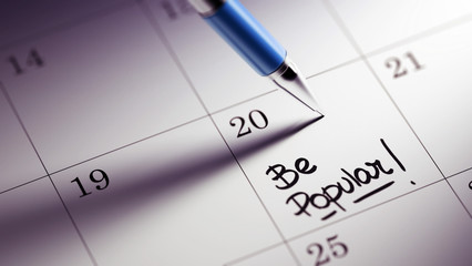 Closeup of a personal agenda setting an important date written w