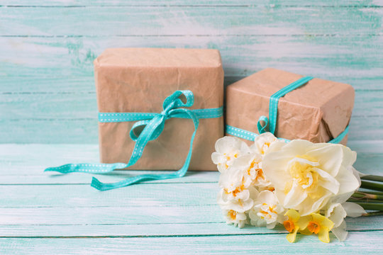Festive present boxes  and flowers  on turquoise painted wooden