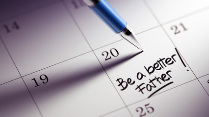 Closeup of a personal agenda setting an important date written w