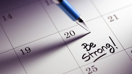 Closeup of a personal agenda setting an important date written w