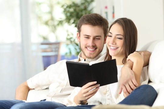 Couple reading a guide in an ebook