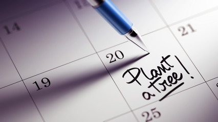 Closeup of a personal agenda setting an important date written w