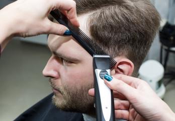 The young man at the hairdresser salon hairstyle make model