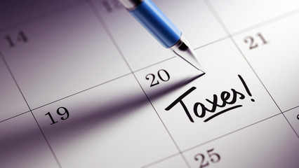 Closeup of a personal agenda setting an important date written w