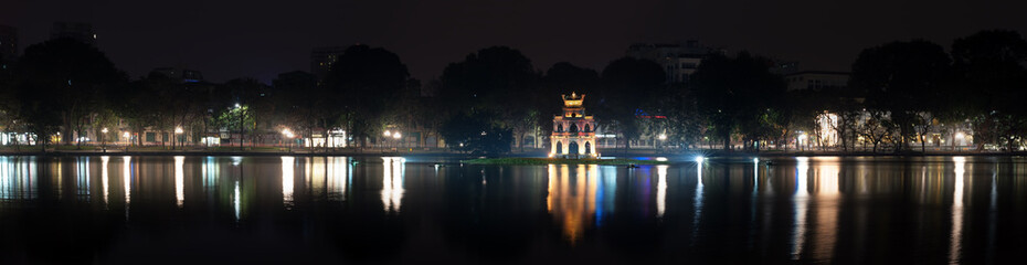 Night panorama of Turtle tower or Tortoise tower in Hoan Kiem lake in Hanoi, Vietnam