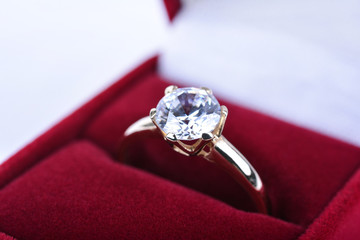 Wedding ring in a red gift box © d_zheleva
