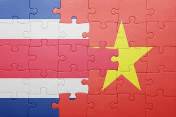 puzzle with the national flag of costa rica and vietnam