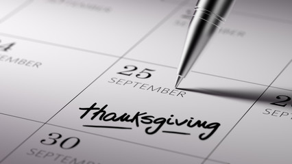 Closeup of a personal agenda setting an important date written w