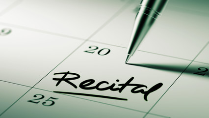 Closeup of a personal agenda setting an important date written w