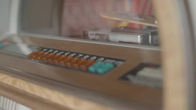 Man turn on jukebox