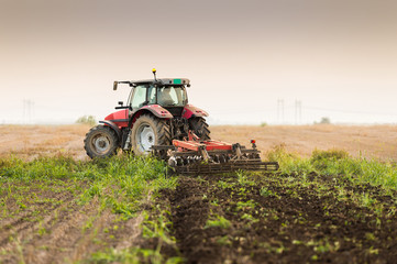 tractor plowing a field