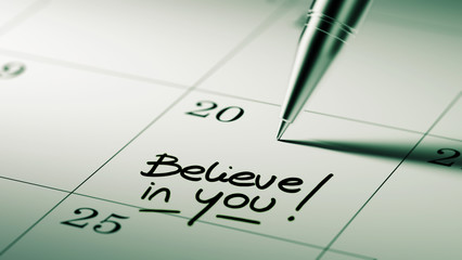 Closeup of a personal agenda setting an important date written w