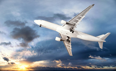 Fototapeta na wymiar Airplane transportation. Jet air plane flies in blue sky