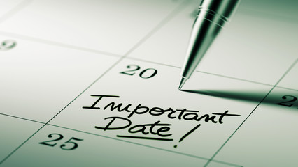 Closeup of a personal agenda setting an important date written w - obrazy, fototapety, plakaty