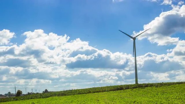 Time lapse of a wind power plant with variable speed in the countryside