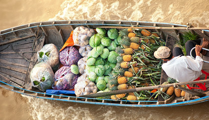 Boat with vegetables in Vietnam floating market  - 99874367