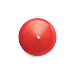 Unused red wax candle isolated