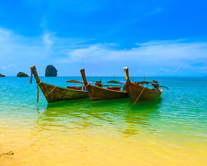 Fototapeta na wymiar Thailand travel landscape. Wooden boats at sunny summer day