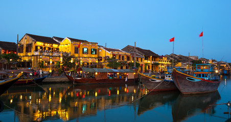 Yellow buildings of Hoi An , Vietnam after sunset - obrazy, fototapety, plakaty