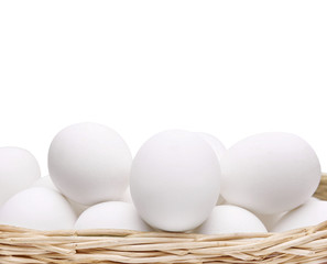 Chicken eggs in a basket.