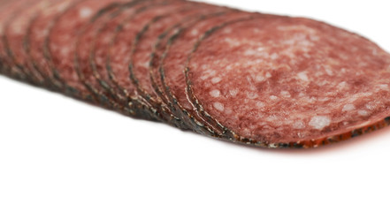 Stack of multiple salami slices isolated