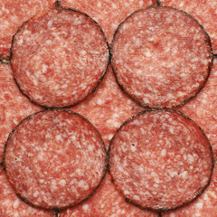 Surface covered with slices of salami