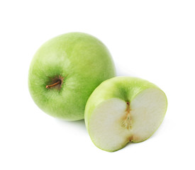 Green apple next to a slice isolated