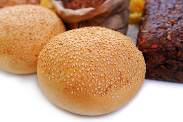Composition of mixed breads, macaroni and grains on white background