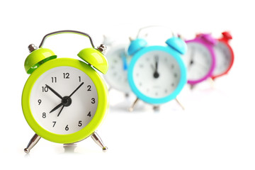 A group of alarm clocks, isolated on white