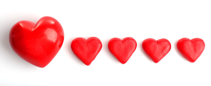 Five red hearts, isolated on white
