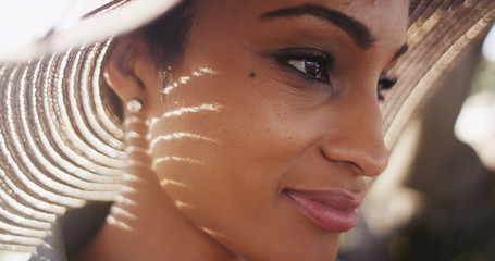Close up backlit shot of beautiful African American woman wearin