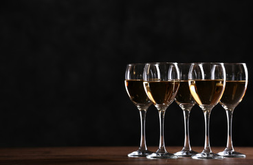 Half full wine glasses on a table
