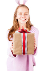 Present box in girl hands isolated, selective focus