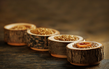 Burning wooden candle with sea salt, closeup