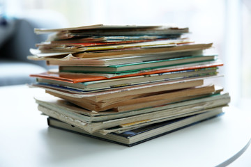Pile of old books on white table