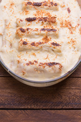 Italian Food. Hot tasty Lasagna plate served with fresh basil le