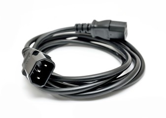 Fototapeta premium Black power cord with detail on the C14 (IEC320) connector on a white background.