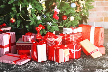 Presents under the Christmas tree on floor