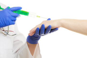 Female doctor with syringe giving injection to patient.