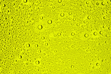 Yellow water drops background.