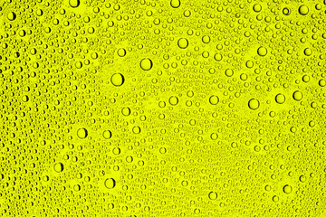 Yellow water drops background.
