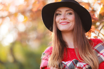 Beautiful woman in autumn park