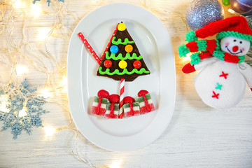 Delicious Christmas cookie with jelly on table
