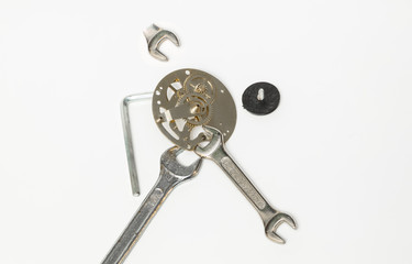 Nice closeup view of old vintage gear parts mechanism with wrenches isolated on light grey background
