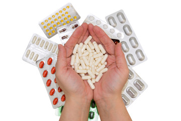 Obraz premium Pills in hands and bags of drugs on isolated background