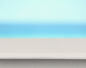 White wooden table on blue background